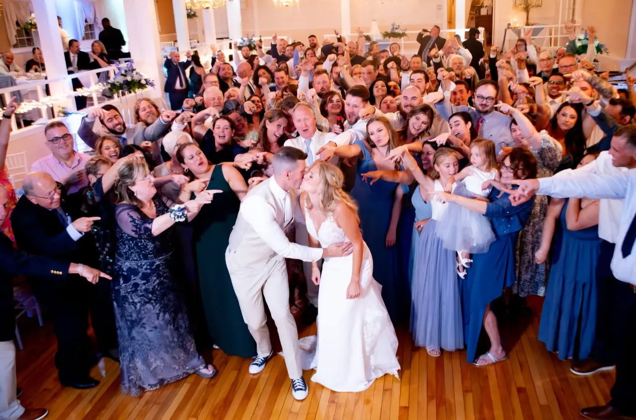 Wedding guests celebrating on the dance floor